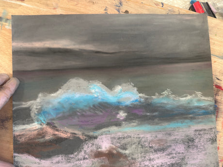 A stunning ocean wave painting in cool blues and greys.