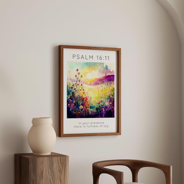A peaceful meadow-themed Bible verse print with lush greenery and wildflowers. The scripture "In your presence there is fullness of joy" is elegantly placed under the artwork, while the Bible reference stands out in bold capital letters above.