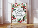 Festive 'Joy to the World' art surrounded by red berries and holly leaves.