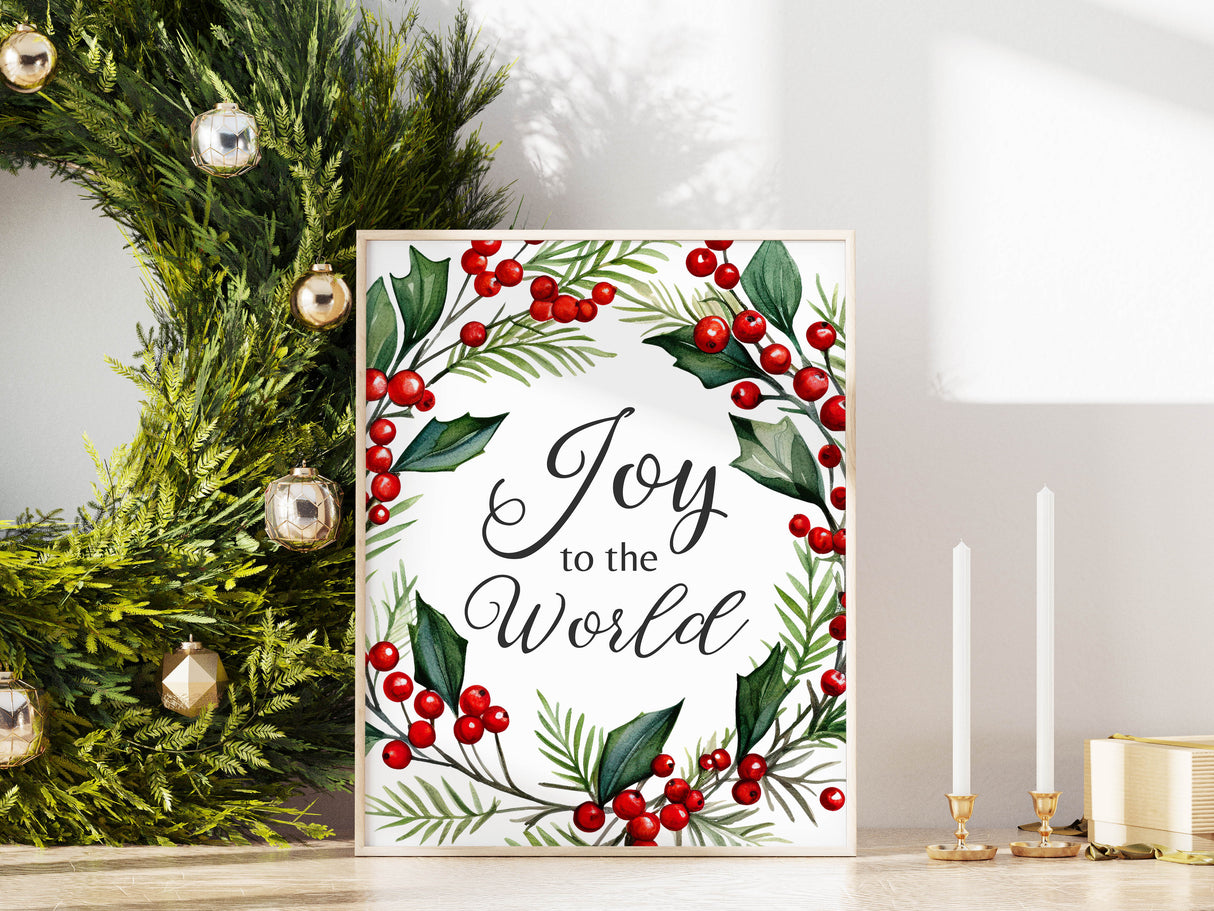 Seasonal wall art showing 'Joy to the World' framed by festive holly and berries