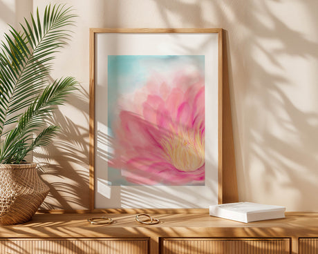 Close-up lotus artwork showing soft pink petals and yellow detail on a blue background.