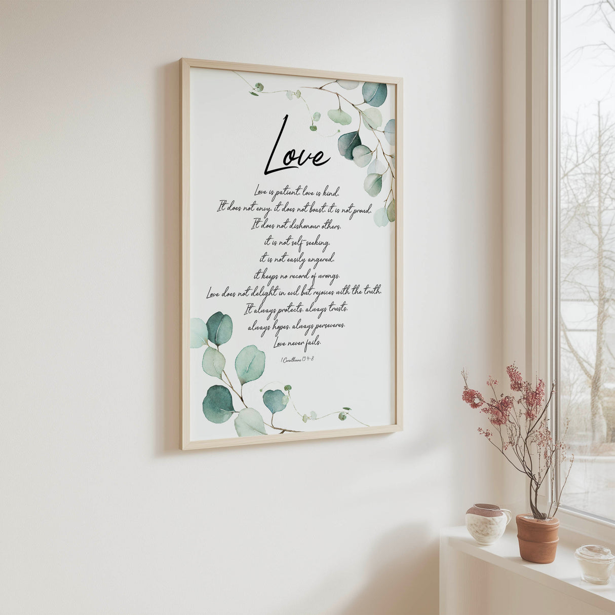 Botanical Bible verse print with elegant green foliage surrounding a passage from 1 Corinthians 13.

