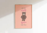 Adorn your nursery walls with a bear on peachy backdrop, surrounded by the affectionate words 'Love You Beary Much.