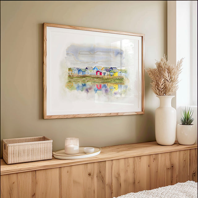 'Beach Huts 1' - Watercolour beach huts print of the colourful Mudeford Spit beach huts reflected in the water — coastal wall art and Dorset prints for seaside home decor, by Crafty Cow Design.