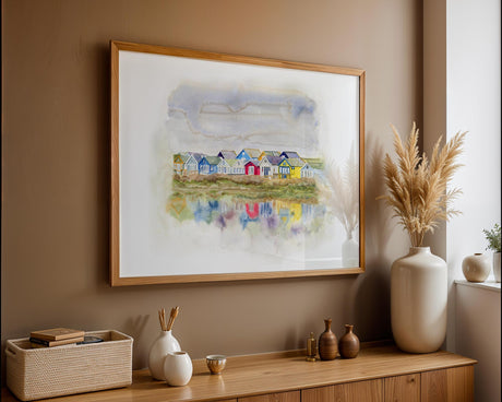 Watercolour print of Mudeford beach huts with colourful reflections on water