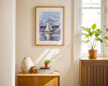 Coastal seascape featuring a yacht gliding in Poole Bay under a soft sky.