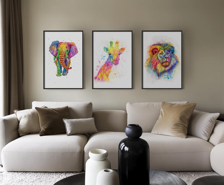 A unique trio of rainbow animal prints, featuring a giraffe, lion, and elephant in bold watercolour.