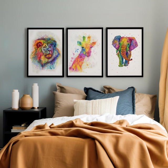 Hand-painted watercolour prints of an elephant, giraffe, and lion in bright rainbow colours.
