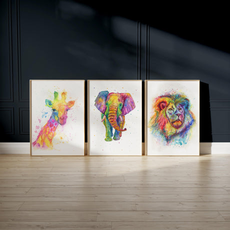 Colourful watercolour animal prints of a giraffe, lion, and elephant in a modern rainbow style.