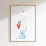 A cute blue elephant holding a rainbow umbrella, with colorful raindrops falling around it.