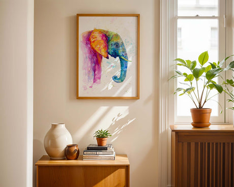 Colourful elephant painting with pink, blue, green, and yellow hues in loose watercolour style.
