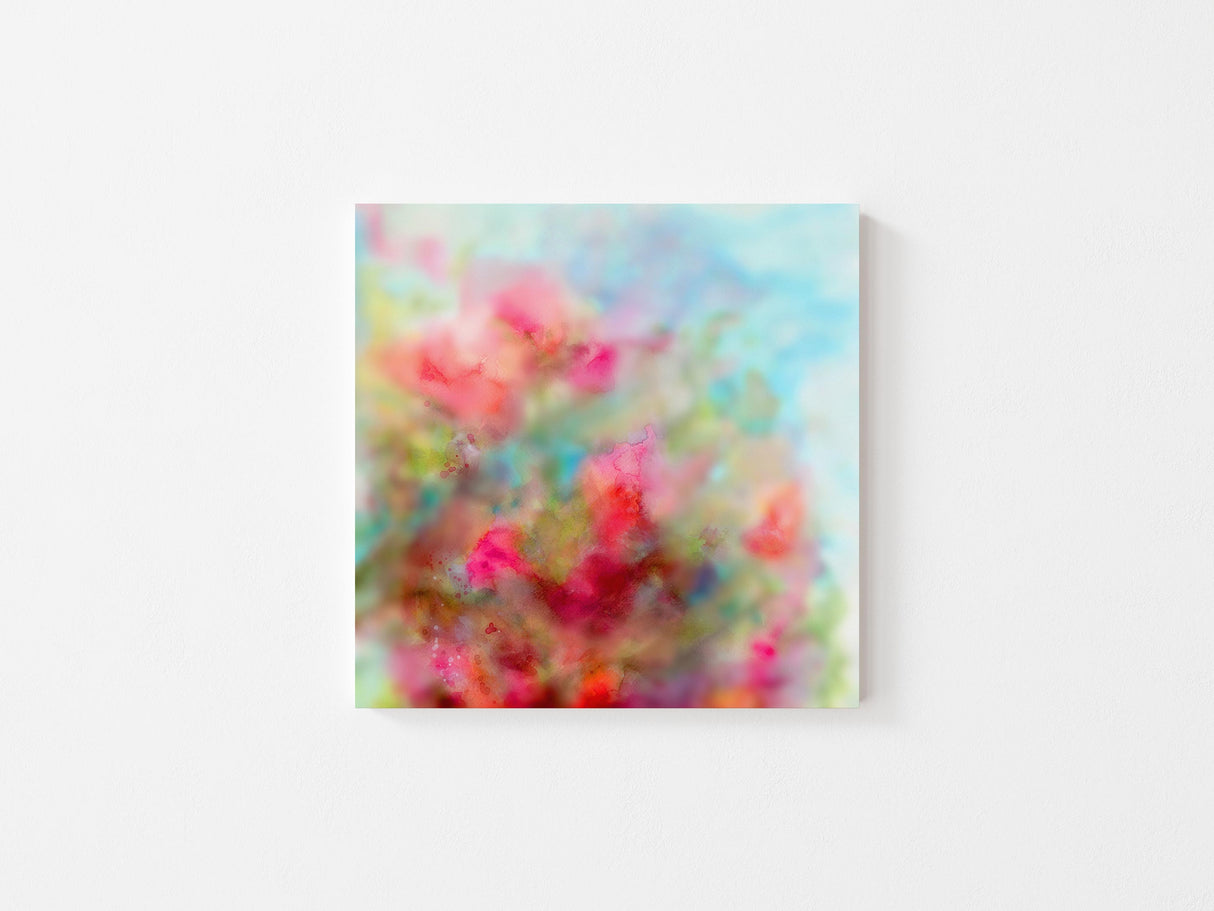 Abstract watercolour print of flowers blooming on a tree with warm and cool tones.