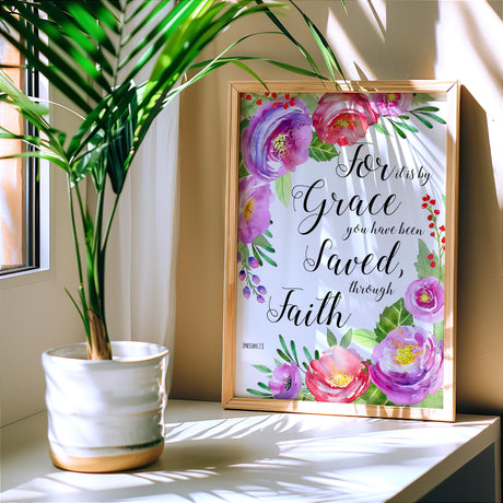 Inspirational Scripture print with soft floral design and words from Ephesians 2:8. Feminine Bible verse artwork combining a pretty pink flower motif and a message of grace.