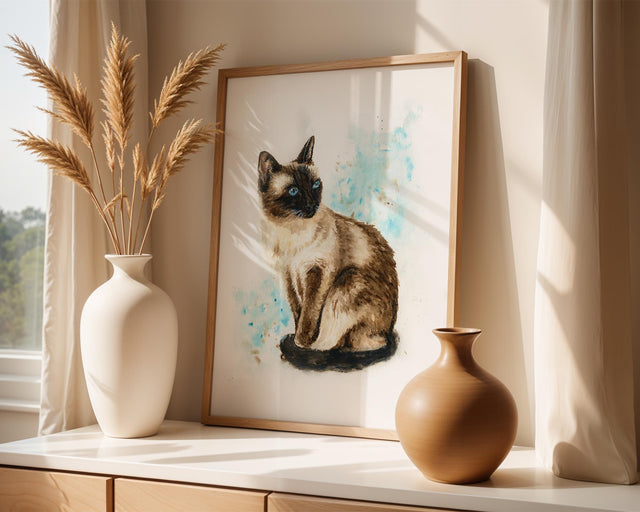 Whimsical watercolour artwork of a Siamese cat sitting calmly, with splashes of soft blues and browns creating a dreamy, painterly effect.