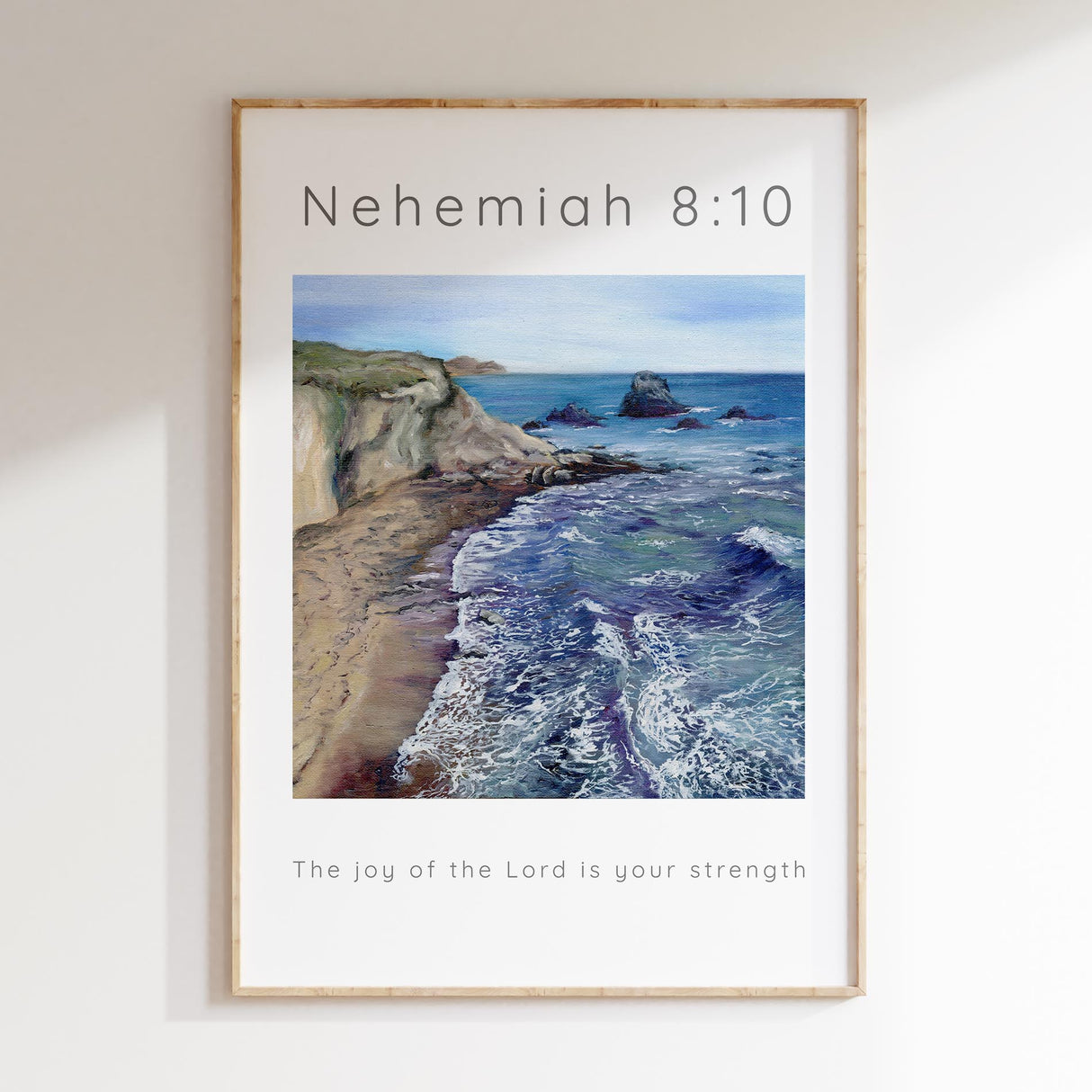 Bible verse wall art with sea waves and cliffs, based on Nehemiah 8:10.