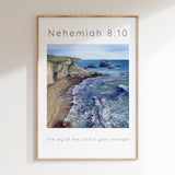 Bible verse wall art with sea waves and cliffs, based on Nehemiah 8:10.
