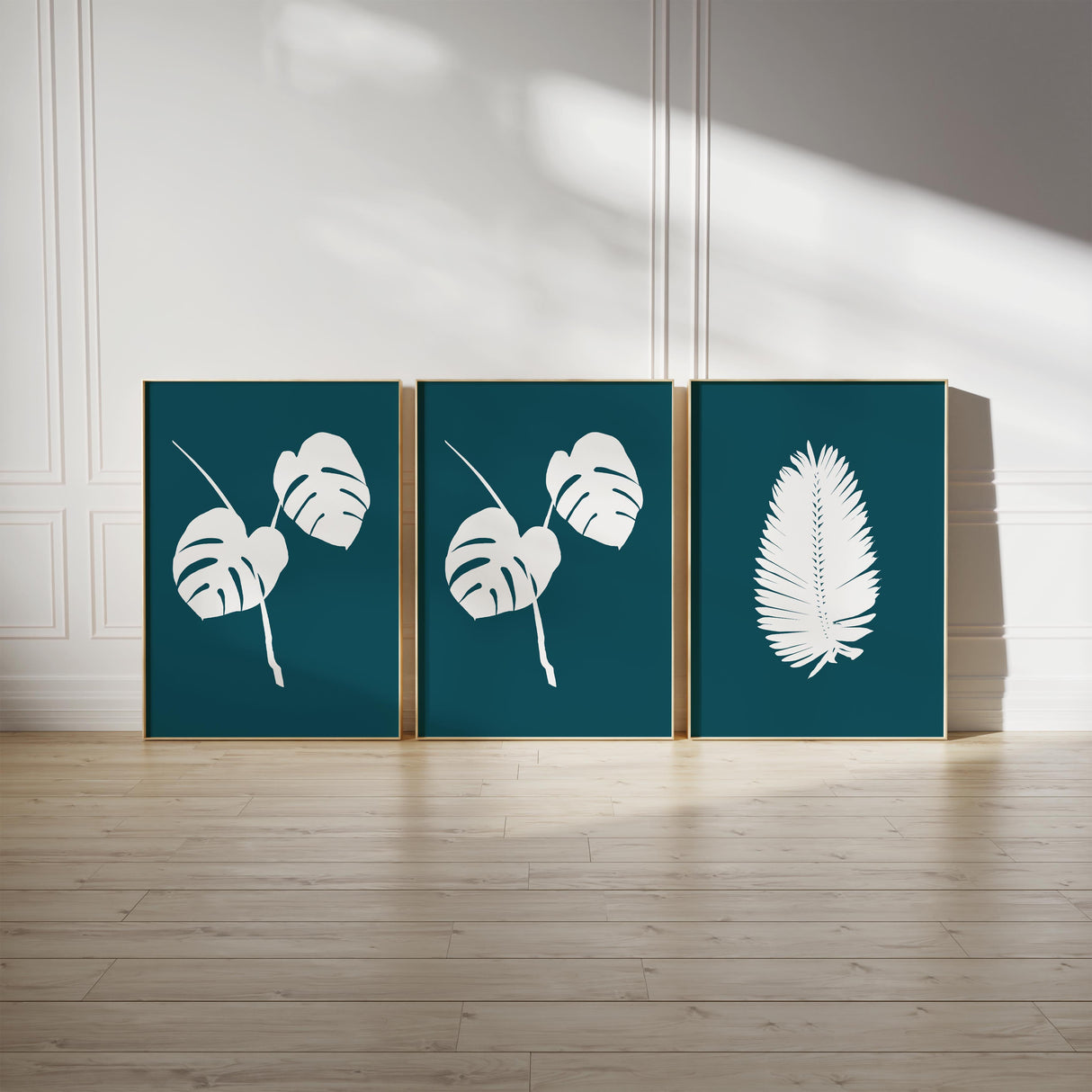 Hand-drawn tropical leaf line art print set of three, showcasing elegant botanical silhouettes with background colour options to suit your space.