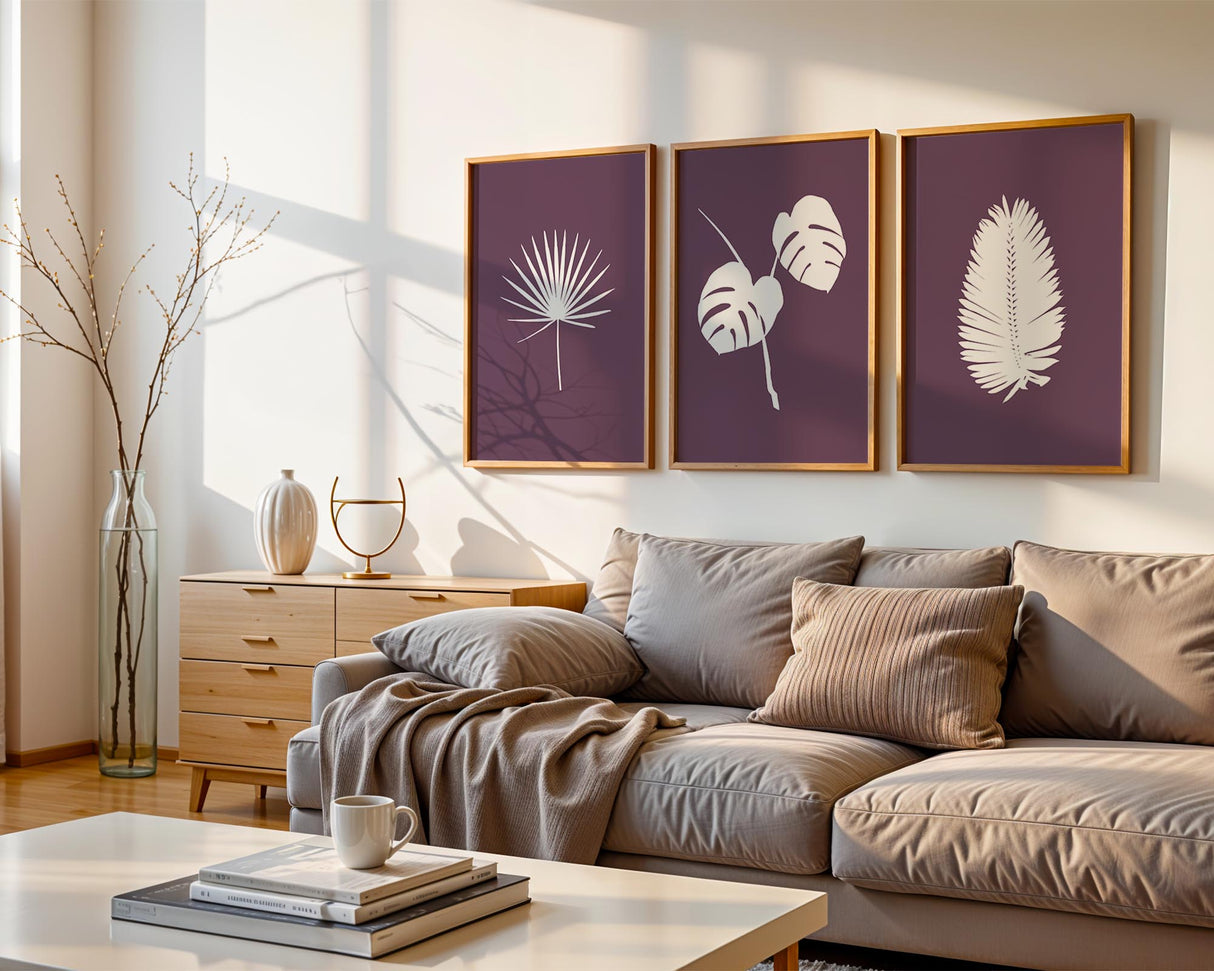 A set of three botanical prints featuring delicate, hand-drawn tropical leaf silhouettes in fine line art, with customizable background colours.