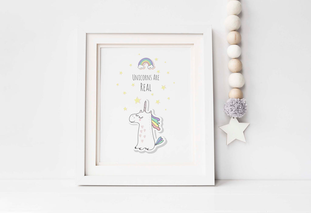 Enchant your walls with a 'Unicorns are Real' print, showcasing a rainbow and a colorful unicorn for a magical nursery decor.