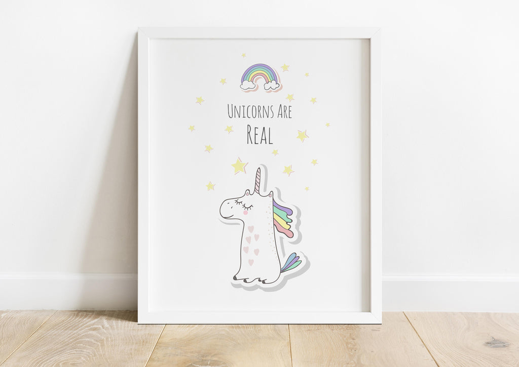 Elevate your décor with an enchanting unicorn print, celebrating the magic of unicorns with a captivating rainbow and the phrase 'Unicorns are Real.'