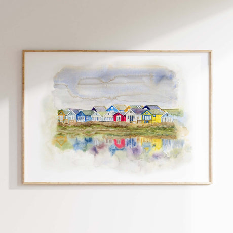 Loose watercolour art print of Dorset beach huts in red, green, yellow and blue