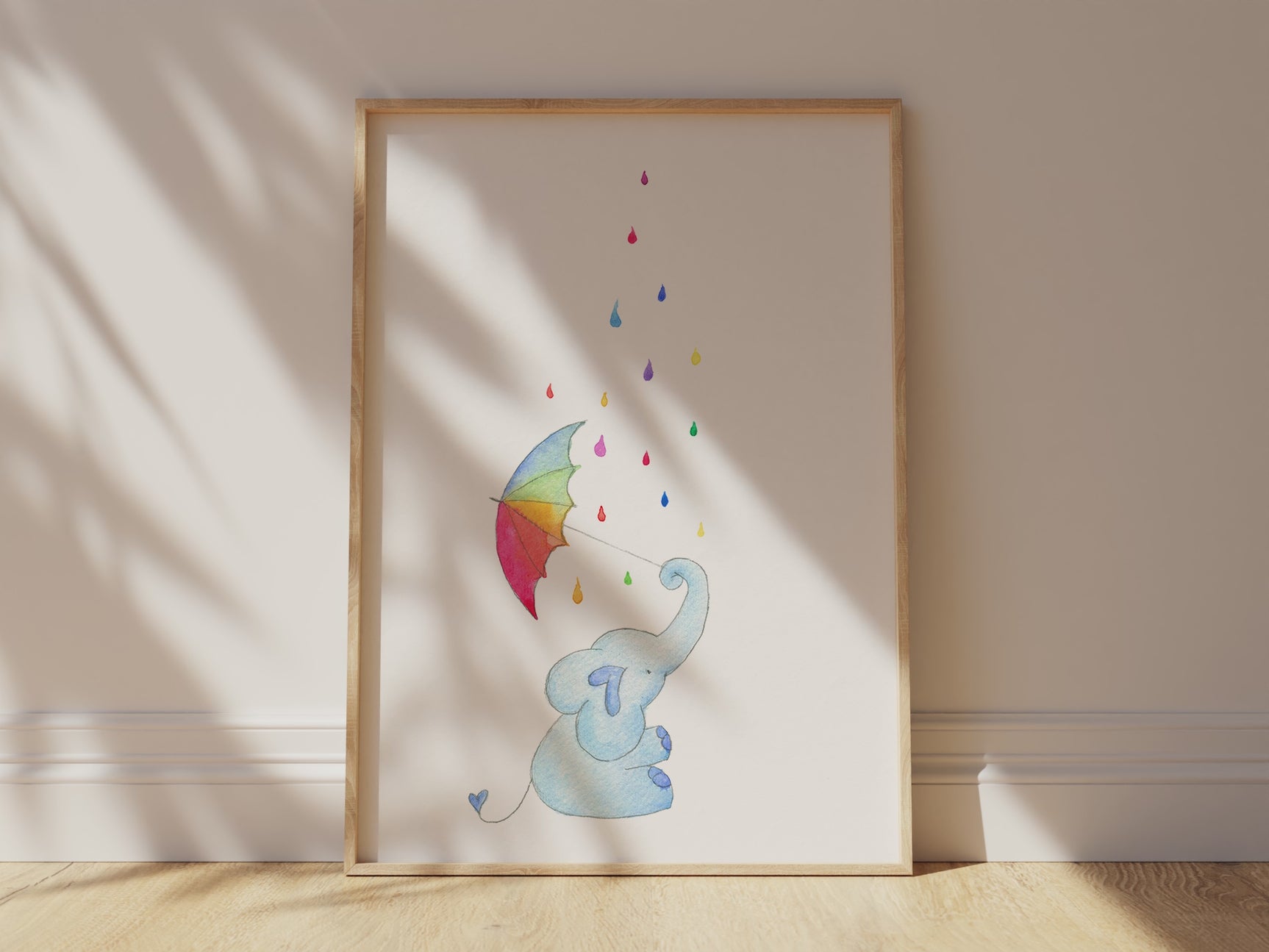 A heartwarming baby room print with a blue elephant in the rain under a multicolored umbrella.