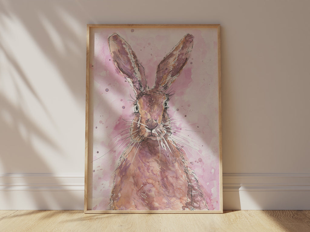 Watercolor hare print featuring a graceful hare against a vibrant pink spatter background, blending elegance with artistic flair in a unique wildlife-inspired artwork.